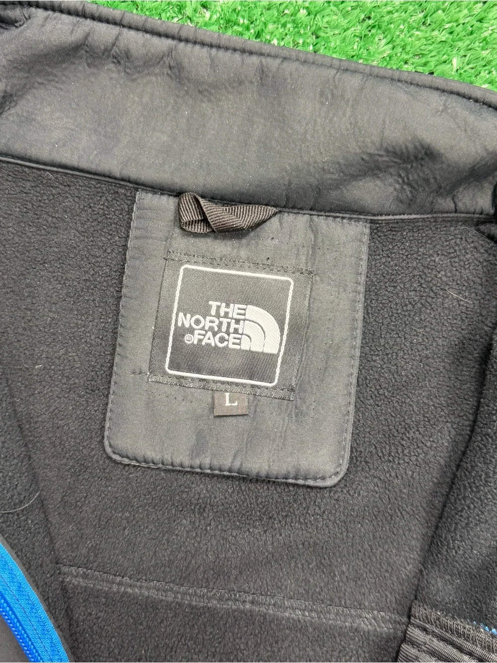 The North Face Black Jacket with Blue Zipper Accents